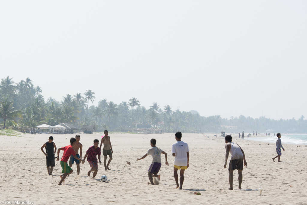 Locals play football in Ngwe Saung
