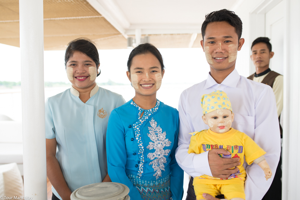 The Strand Cruise's ever-smiling staff with their thanaka model