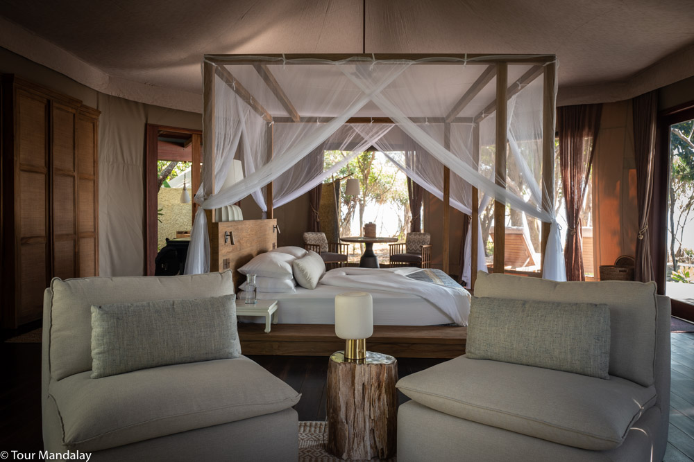 Inside Tented Beach Villa with sofa and table lamp